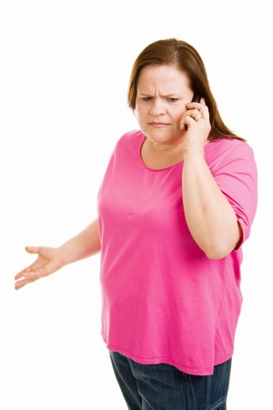 Upset Woman On Phone - crohn's disease treatment in charlotte