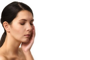 Woman Holding Her Face - charlotte migraine treatment