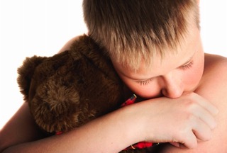 Child Holding Bear - hormone imbalance treatment in charlotte
