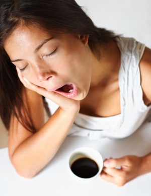 Sleepy Woman Drinking Coffee - charlotte hormone imbalance treatment