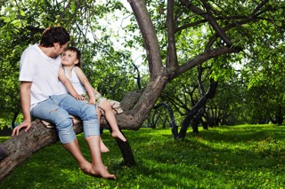 Father and Daughter Sitting On Tree Branch - charlotte autoimmune disorder treatment
