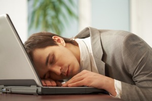Man Sleeping At Computer - charlotte hormone imbalance treatment