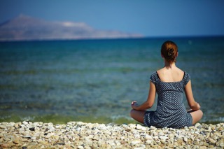 Woman Meditating At The Beach - charlotte hormone imbalance treatment