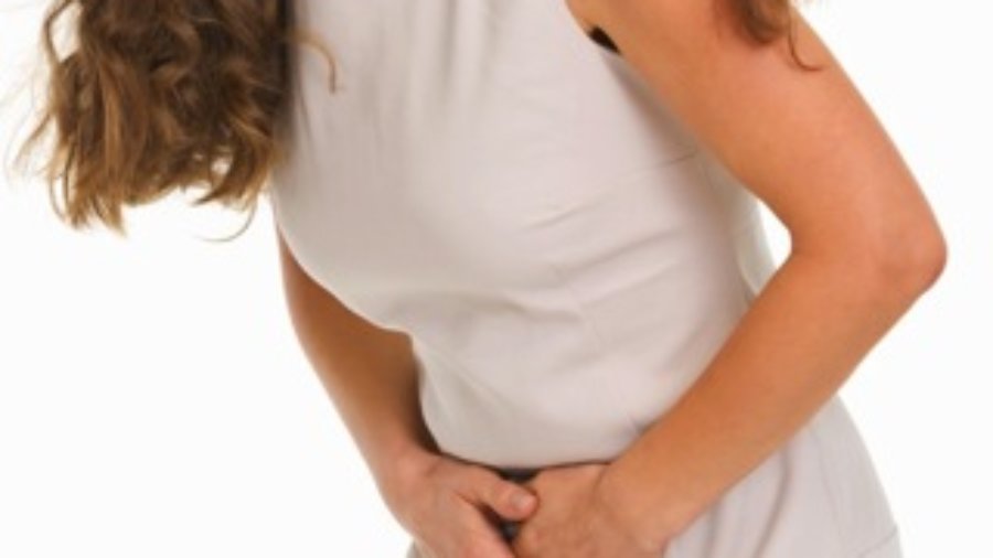 Woman With Stomach Cramps - autoimmune treatment in charlotte