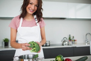 Woman Cooking Vegetables - charlotte weight loss programs