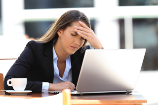 Confused Woman At Computer - migraine treatment in charlotte