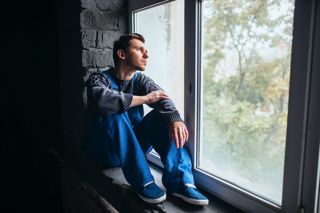 Man Sitting At Window - hormone imbalance treatment in charlotte