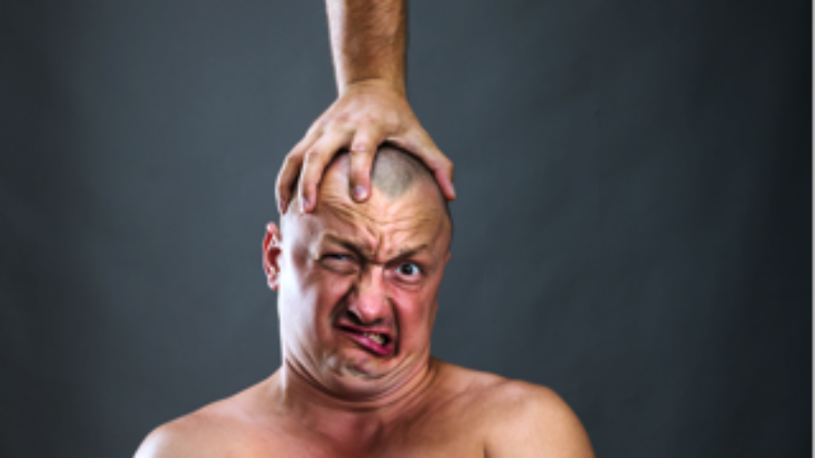 Man With Hand On His Head - charlotte crohn's disease treatment