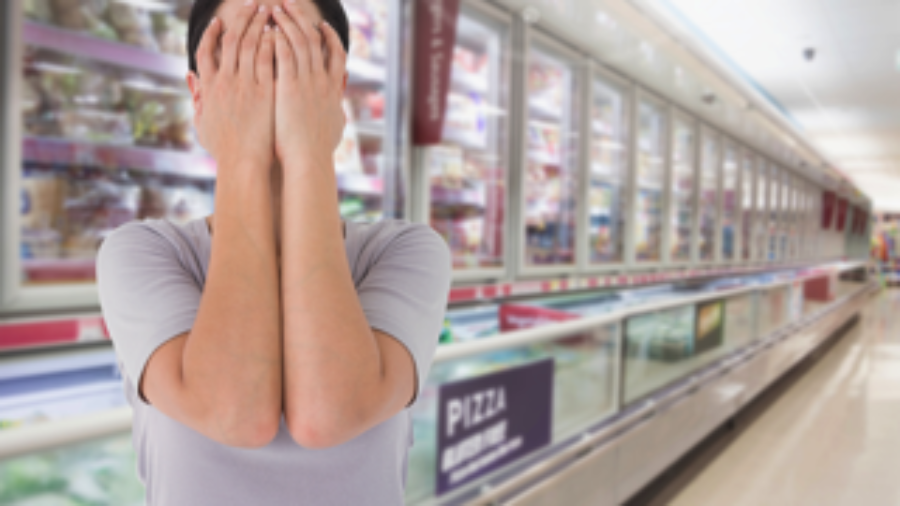 Woman At Grocery Store Holding Face - charlotte hormone imbalance treatment