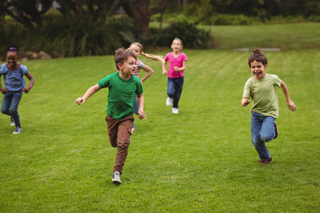 Children Running On Grass - charlotte crohn's disease treatment
