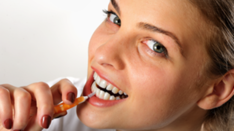 Woman Flossing Teeth - charlotte diabetes treatment