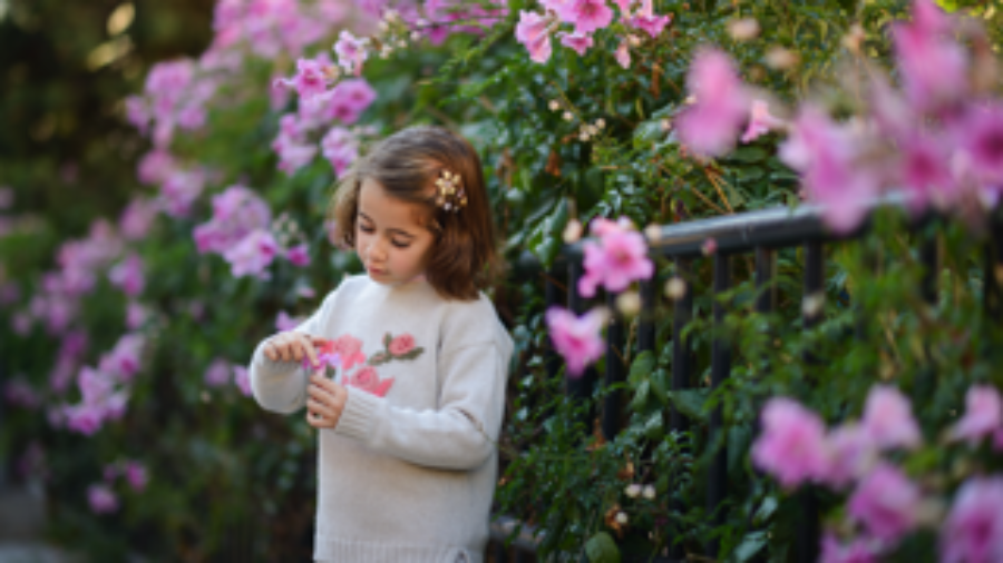 Young Girl Surrounded By Flowers - charlotte autoimmune treatment