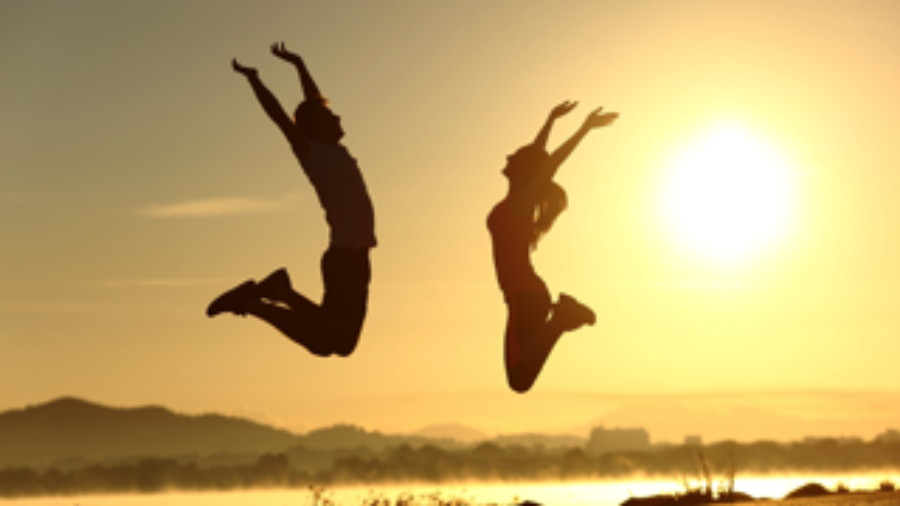 Couple Jumping In The Air - charlotte functional wellness